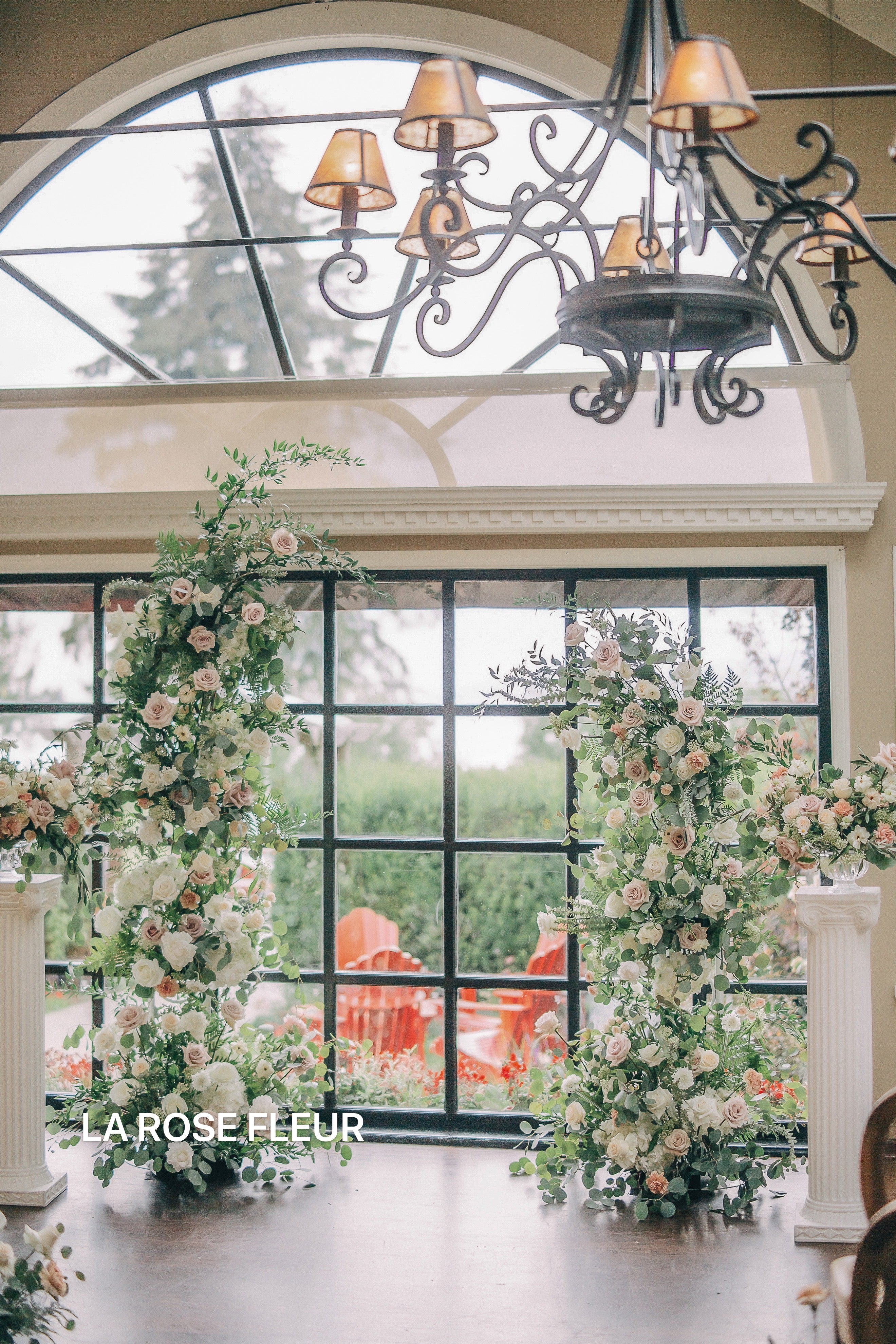 Reception area graced with exquisite flowers by La Rose Fleur, welcoming guests with natural beauty.