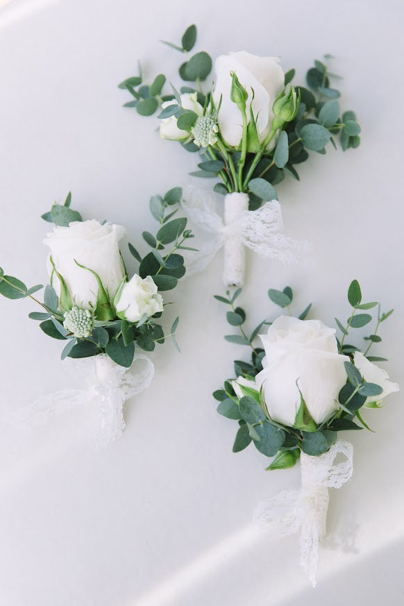 Exquisite boutonnieres and corsages by La Rose Fleur, adding a touch of sophistication to your special occasion.