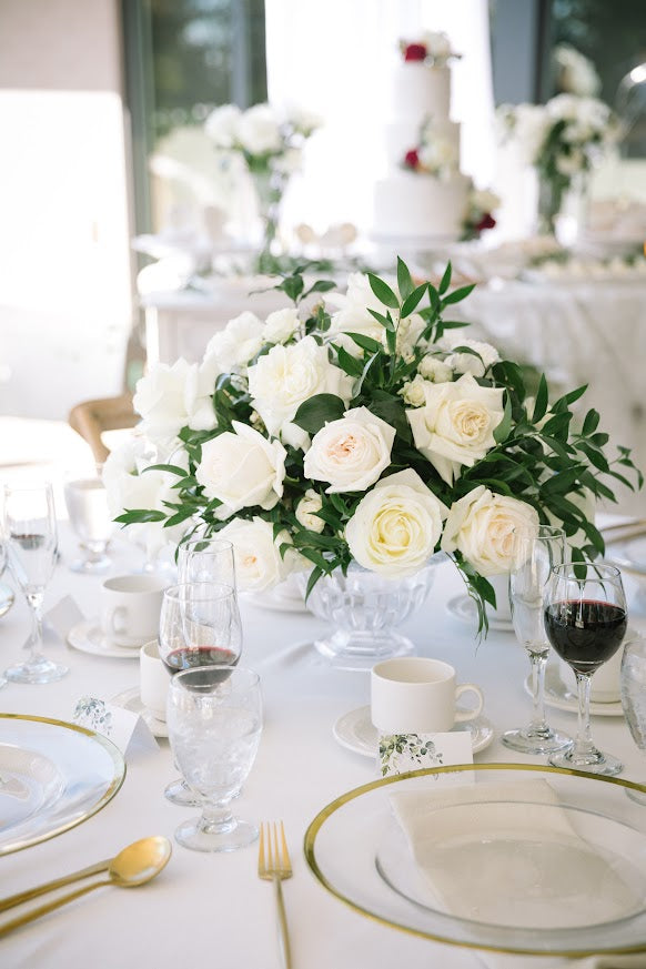 Stunning reception flowers by La Rose Fleur, enhancing the ambiance of your celebration